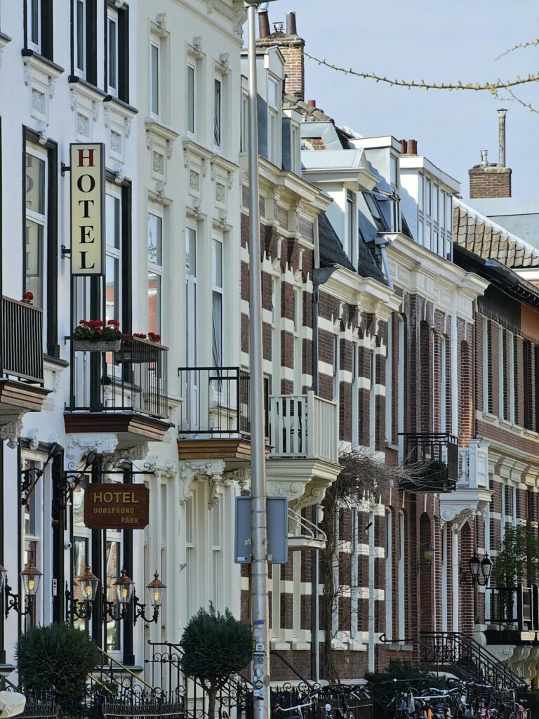 Historic street in Utrecht showcasing classic Dutch architecture and vibrant urban life.