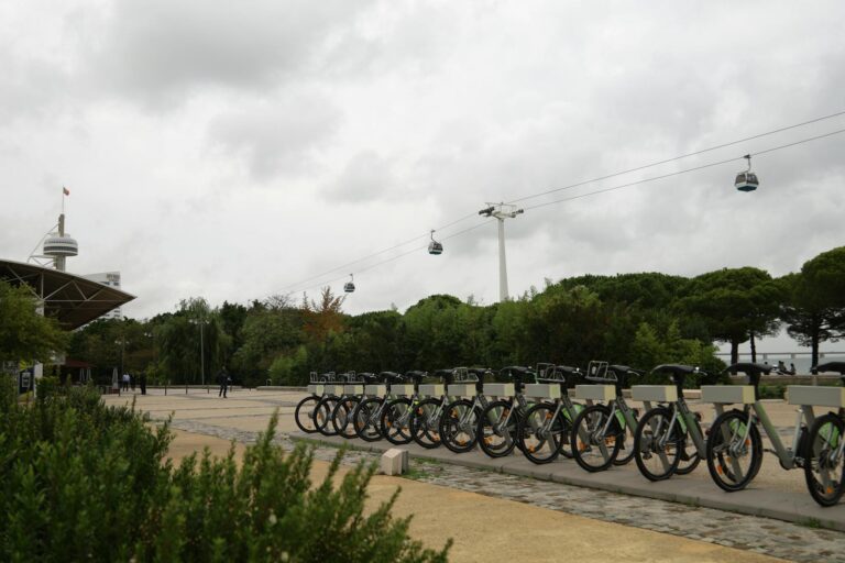 Scenic view of a bike station and cable cars on a cloudy day in Lisbon, Portugal.